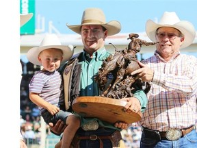 Dustin Flundra of Pincher Creek took home the bronze trophy in the saddle bronc event at the Calgary Stampede earlier this summer.