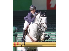 Kent Farrington jumps Uceko to victory during the $85,000 Progress Energy Cup at the Spruce Meadows North American tournament in Calgary.