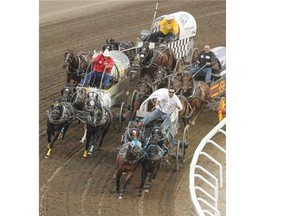 Kurt Bensmiller leads the pack around Turn 4 during Heat 9 on Night 7 of the Rangeland Derby at Stampede Park in Calgary on Thursday.