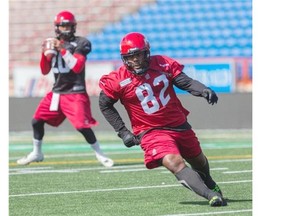 Nik Lewis takes part in practice drills during Stamps training camp at McMahon Stadium on Monday.