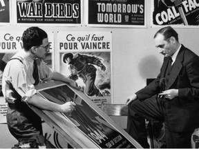 John Grierson, right, the first commissioner (1939-1945) of the National Film Board of Canada, looks at move posters in this handout photo from 1944. The National Film Board is celebrating its 75th anniversary this year with a new documentary about its early years between 1939 and 1945. Called "Shameless Propaganda," it examines the NFB under John Grierson, the messages in the films during the Second World War and how they defined Canada. It will premiere Tuesday on the CBC channel documentary, before streaming for free online at NFB.ca. THE CANADIAN PRESS/HO - National Film Board of Canada