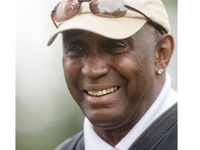 Johnny Rodgers, former Heisman trophy winner and CFL star for the Montreal Alouettes, plays in pro-golfer Tom Pernice’s group during the Shaw Charity Classic Pro-Am in Calgary on Thursday.