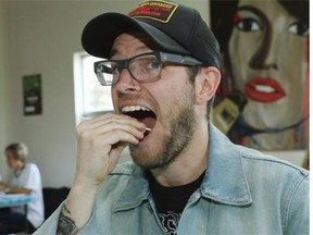 Josh Gwilliam swabs his cheek at the Swab-a-Thon on June 7, 2014 which was held to get people to sign up for the national stem cell donor registry. The inspiration for the event is Al Carpenter, a longtime friend of Village Brewery partner Jim Button’s who was recently diagnosed with a rare form of leukemia.