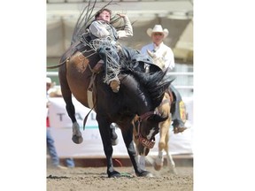 Justin McDaniel rides to a 89.00 atop Saturn Rocket during Day 7 of the Calgary Stampede bareback championship on Thursday.