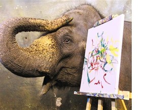 Former Calgary Zoo elephant poses with one of her paintings. Reader says forcing such intelligent animals to perform tricks at circuses is immoral.