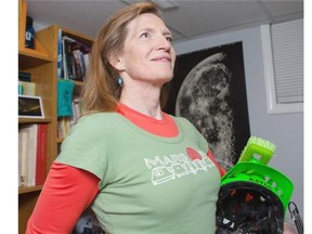 Kayla Bonham, 57, holding a homemade Marvin the Martian helmet in her Calgary home on Monday, is on the short list of applicants to go to Mars as part of a Dutch non-profit’s proposed project to establish a human colony on the planet in 2024.