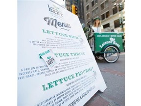 Kirsten Lankester with her new food tricycle business, Lettuce Beet, on her Stephen Avenue corner in Calgary, on June 23, 2014. Lankester’s new salad selling business is giving the downtown lunch crowd something new, quick, healthy and delicious to munch on. 
 Photo by Crystal Schick/Calgary Herald