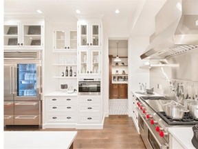 The kitchen boasts an extra-wide gas stove and large fridge.