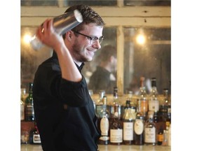 The Lake House Restaurant Bar Supervisor Mike Squire with his signature cocktail, a Cherry Sour.