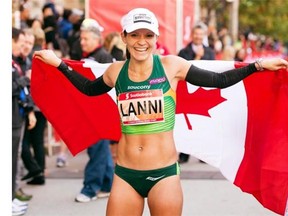 Lanni Marchant celebrates after crossing the line to set a new Canadian record at the Toronto Waterfront Marathon with a time of 2:27:59 last October. She will be running the half marathon in Calgary on Sunday.