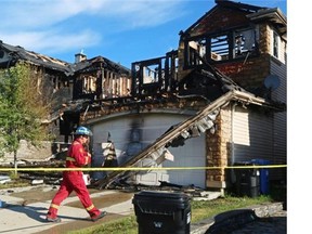 At least one of two homes damaged by a fire early Monday will have to be demolished, fire officials say.
