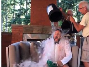 Alberta NDP leader Brian Mason, dumps ice water on Alberta Premier Dave Hancock as part of the ALS ice bucket challenge