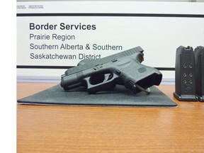 A loaded .40-calibre pistol was one of three firearms seized in separate incidents by officers at southern Alberta border crossing on the weekend. Three American men have been charged.