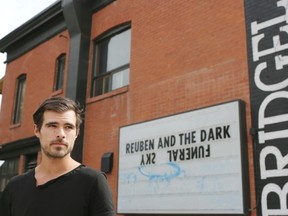 Local musician Reuben Bullock poses for a photo in Bridgeland on May 23, 2013. (Photo by Leah Hennel, Calgary Herald)