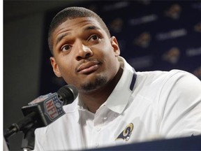 St. Louis Rams seventh-round draft pick Michael Sam listens to a question during a news conference at the NFL football team's practice facility Tuesday, May 13, 2014, in St. Louis. (AP Photo/Jeff Roberson)