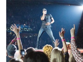 Luke Bryan shows off his moves during his performance at the Scotiabank Saddledome in Calgary on Friday.