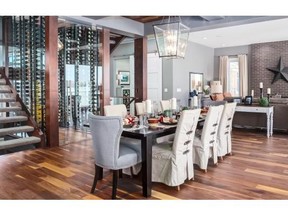 The luxurious dining area in Trickle Creek Custom Homes’ show home at Bearspaw. Luxury home sales have increased in the Calgary area.