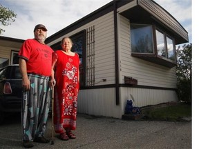 Marc Dufour, with his mother Elizabeth Dufour, outside their home in Midfield Mobile Home Park. The park will be closed in 2017. (Stuart Gradon/Calgary Herald)
