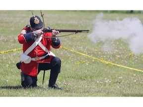 Members of the Southern Alberta Horse Artillery reenactment group perform a demonstration of an 1885 military operation at the Summer Skirmish event at the Military Museums in Calgary, Alberta Saturday, June 7, 2014.