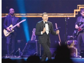 Michael Buble performs to a packed house at the Scotiabank Saddledome on Monday.