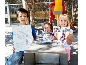U of C Mini University campers, Jimmy, age 8, left, Tamila, age 6, centre, and Alexis, age 5 and a half, right, opened a time capsule containing letters and photos from the Mini U campers of 1984 in Calgary. (Jenn Pierce/Calgary Herald)