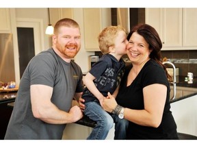 James Sloane, Toby Meyer and their son Oliver in the kitchen of their home by Jayman MasterBuilt in Mahogany.