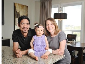 John and Erin Hasegawa with their daughter Jeanie. The family bought a laned home at Horizons in Williamstown in Airdrie.