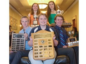 The most outstanding female athlete over three years, Katelyn Dimmel of Bishop Grandin High School, clockwise from back left, the best female track and field athlete, Siri Svensson of Queen Elizabeth High School,  the most outstanding male athlete, Jared Armstrong of Bishop Carroll High School, the most outstanding male or female student in the small schools, Aleena Kleiner of Alternative High School, and the best male track and field athlete, Alex James of Crescent Heights High School, as presented by the Calgary Booster Club and the Calgary Senior High School Athletic Association in Calgary on Monday.