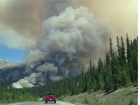 The Spreading Creek Wildfire in Banff National Park. On Saturday July 12, 2014. Both Highway 93N (Icefields Parkway) between Waterfowl Lakes Campground and Rampart Creek and HWY 11 were closed. (Courtesy Parks Canada/Calgary Herald) For City story by Colette Derworiz