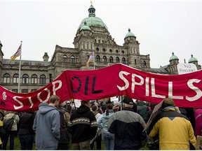 Protesters take part in a mass sit-in in front of the British Columbia legislature in Victoria, B.C. on Oct. 22, 2012, to protest the proposed Northern Gateway pipeline.