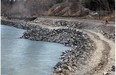 A long section of the Bow River Pathway in Edworthy Park is being reconstructed as een Monday May 12, 2014. There is large scale work been done on the south banks of the river which were scoured away for a kilometre during last June's floods.