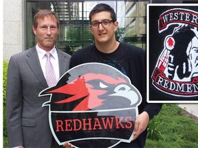 Western Canada High School principal Kim Hackman and Grade 11 student Mihnea Nitu unveil the new name and logo, Redhawks, for the school's athletics teams. Inset shows the old logo.