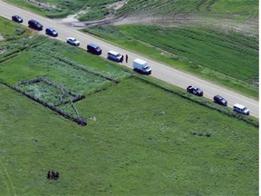 RCMP members continue their search for evidence in a field northeast of Airdrie on July 7, 2014. Police are still looking for clues into the disappearance of Nathan OÕBrien and his grandparents Alvin and Kathy Liknes.