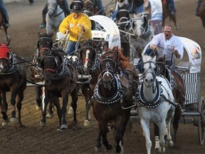 Chuckwagons race in last year's Calgary Stampede. Reader says the Vancouver Humane Society feels cruelty is still a problem at the Stampede.