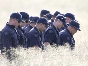 RCMP scour a property northeast of Airdrie Saturday afternoon. Authorities are remaining tight lipped about the nature of the investigation.