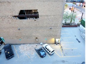 Vehicles were damaged by bricks falling off the wall of a building at 6th Avenue and 7th street S.W.