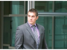 Calgary Flames' Michael Ferland leaves the Calgary Courts Centre during a break in his assault trial on June 9, 2014.