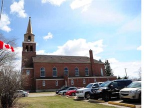 Father Gerard Gauthier held mass at St. Paul cathedral two days after another priest, Fr. Gilbert Dasna, was shot and killed at the priests' residence in St. Paul, May 11, 2014.