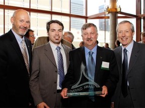 Simon Knight and the team from Climate Change Central (C3) with an award they received in 2011.