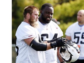 Ottawa Redblacks offensive linemen Jon Gott, left, and J’Micheal Deane are among the former Calgary Stampeders returning to face their old team this week.