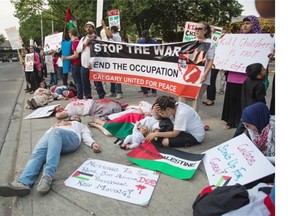 Pro-Palestinian supporters gathered for another night of peaceful protest at City Hall in Calgary on Wednesday. (Jenn Pierce/Calgary Herald)