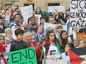 Palestinian supporters take part in a rally at City Hall in Calgary on July 25, 2014.