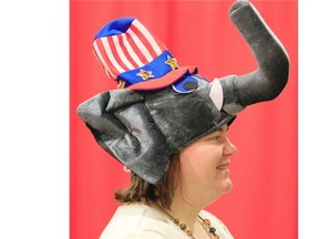 Tea Party volunteer Margaret Foland, from Arlington, Texas, wears an elephant hat on sale at the Republican convention in Fort Worth.