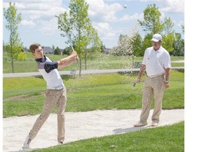 Patrick Murphy, left, works on his game with his coach and mentor, Paul Horton, right, at Heritage Pointe Golf Club recently.