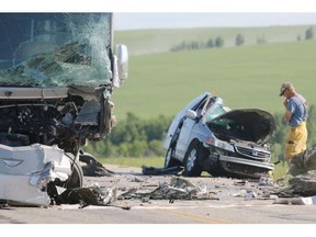 Two people were killed when a minivan crossed the centre line and collided with a motorhome near Cremona on Sunday, one of five fatal crashes in Alberta on the weekend.