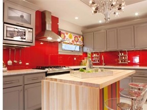 Photo Meg Caswell, designer and host of HGTV’s Great Rooms, painted this kitchen’s walls red then added a clear glass cover to create a chic, vibrant backsplash.