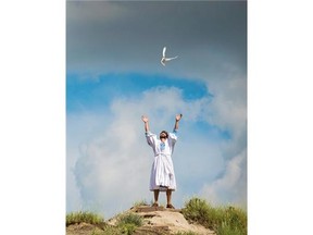 Photo courtesy Ron Nickel 
 Brian Jensen as John the Apostle in The Canadian Badlands Passion Play, in Drumheller, Alberta.