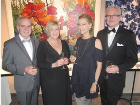 Pictured, from left, at the Banff Centre  Midsummer Ball July 19 are Dan Buchner, vice-president of the Peter Lougheed Leadership Institute and his wife Lauren with Carolyn Warren, vice-president of arts programming at the centre  and Dialog architect Robert Claiborne. (phtg}/For the Calgary Herald (For Entertainment section story by Bill Brooks)