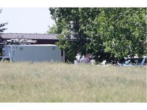Police investigators were collecting evidence at the Airdrie acreage in association with the Amber Alert Thursday.