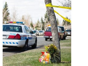 A police car near the home where Sanjula Devi and Fahmida Velji-Visram were fatally stabbed in Calgary. (Jenn Pierce/Calgary Herald)